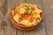Amazing Mexican guacamole nachos recipe in clay pot with melted cheddar cheese and jalapenos
