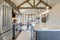 Amazing modern and rustic luxury kitchen with vaulted ceiling and wooden beams, long island with white quarts countertop
