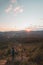 Amazing moment at sunrise as a hiker celebrates his climb up the mountain and completing another point on the map. Trying to