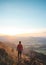 Amazing moment at sunrise as a hiker celebrates his climb up the mountain and completing another point on the map. Trying to