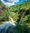 Amazing morning view of Plitvice National Park. Bright spring scene of green forest with pure water lake and waterfall. Great coun