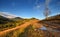 Amazing mountain landscape with colorful trees and herbs. Autumn sunny morning. Carpathian, Ukraine