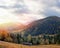 Amazing mountain landscape with colorful trees and herbs. Autumn sunny morning. Carpathian, Ukraine