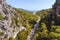 Amazing mountain landscape with winding road and coniferous forest