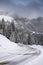 Amazing mountain road covered with snow in a winter morning, great landscape