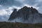 Amazing mysterious landscape view of an immense  rugged rock formation in a misty rainy day