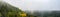 Amazing mystical rising fog forest autumnal trees landscape in black forest Germany panorama banner - Dark autumn