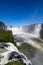 Amazing National Park of Iguazu Falls with a full rainbow over the water, Foz do IguaÃ§u, Brazil