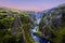 Amazing nature of Iceland. Impressive view on picturesque canyon Fjadrargljufur with colorful sky and reflections. Tipical