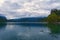 Amazing nature landscape of Bled Lake. Ancient Castle on the top of the rock. Famous island with church at the background