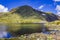 Amazing Norway landscape boulders and lake summit top of mountain