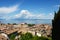 Amazing panorama from Desenzano castle on Lake Garda with old city roofs, mountains, white clouds and sailboats on the lake, Desen