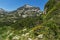 Amazing panorama with Dzhangal peak and Spring flowers in Pirin Mountain