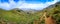 Amazing panorama of rough wild mountains, grass, cloudy blue sky, Lasithi, Crete