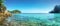 Amazing panorama sandy tropical beach in crystal clear sea