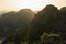 Amazing panorama view of limestone rocks and mountaintops from Hang Mua Temple at evening. Ninh Binh, Vietnam. Travel landscapes