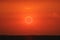 amazing phenomenon of total sun eclipse over cloud sunset red orange sky on the sea