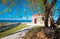 Amazing pictorial view of an old stone church beside blue sea, Milatos, Crete.