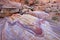 Amazing pink striped rock on Crazy Hill in Pink Canyon, near Fire Wave at sunset, Valley of Fire State Park, USA