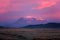 Amazing pink sunset landscape, Iceland. Snow capped peak of the volcanic mount
