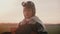 Amazing portrait shot of little girl in fun plane pilot costume smiling at camera with shy peaceful eyes slow motion.