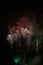 Amazing red fireworks on night sky. New years eve celebration. Ceske Budejovice, Czech republic