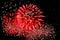 Amazing red fireworks and scattering of white sparks
