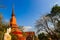 Amazing red pagoda with the Buddha image against blue sky background at Wat Khao Rup Chang Temple. Located along the Phichit-Tapha