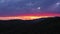 Amazing red sunset or sunrise over mountains silhouette, panoramic landscape with colors dramatic clouds, vibrant orange sunset or