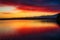 Amazing red and yellow sky colour reflected in Okarito Lagoon