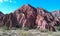 Amazing reddish rock formation with cactus