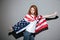 Amazing redhead young lady superhero with USA flag