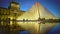 Amazing reflection of illuminated Louvre Pyramid in water, Paris sights at night