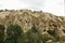 Amazing rocks of Cappadocia with folded slopes, sharp peaks