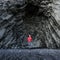 Amazing rocks in iceland and woman torist inside