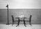 Amazing romantic dinner on the beach. Romance and love, dinning table setup with sea view in cloudy day. Black white photo