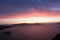 Amazing Santorini sunset, Greece. Colorful sky, blue crystal water, cruise ship