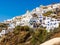 Amazing Santorini view on white cave houses from the Aegean sea. Santorini, Greece