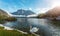 Amazing Scene on the Altaussee Lake. white swan in turquoise water. High mountains lake. Beautiful landscape of alps, Wonderful