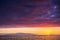 Amazing scenic landscape taken during a wonerful sunset on the ocean. La Gomera oceanic island in background with clouds and water