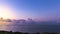 Amazing Scenic sunrise over sea with clouds time lapse with blue, red, and purple light.