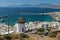 Amazing Seascape of white windmill and island of Mykonos, Greece