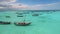 Amazing Seascape With Wooden Boats Floating On A Calm Ocean Surface