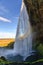 Amazing Seljalandfoss waterfall in sunny autumn day, Iceland. Famous tourist attraction