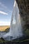 Amazing Seljalandfoss waterfall in sunny autumn day, Iceland. Famous tourist attraction