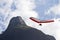 Amazing shot of human flying on a hang glider