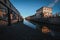 Amazing shot of an old city buildings and a reflective river