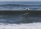 Amazing shot of a professional surfer surfing in the sea with big waves in summer