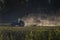 Amazing shot of a tractor working in a farmland