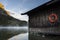 Amazing shot of a wooden house in the Ferchensee lake in Bavaria, Germany